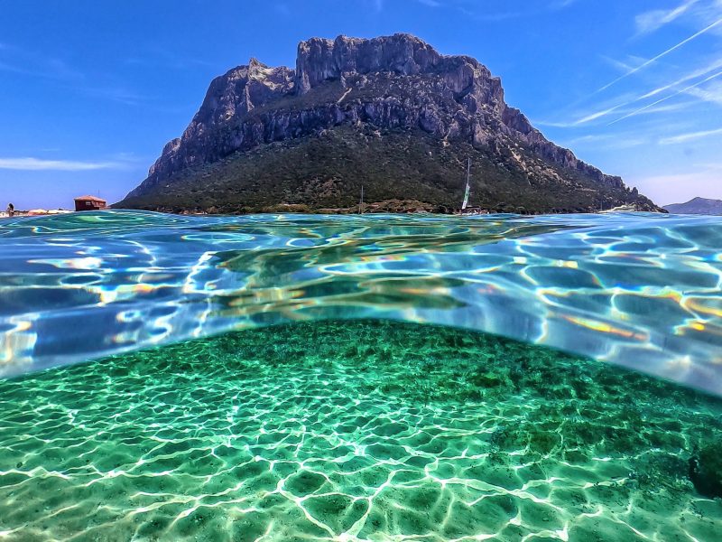 Tavolara island seen from crystal-clear water